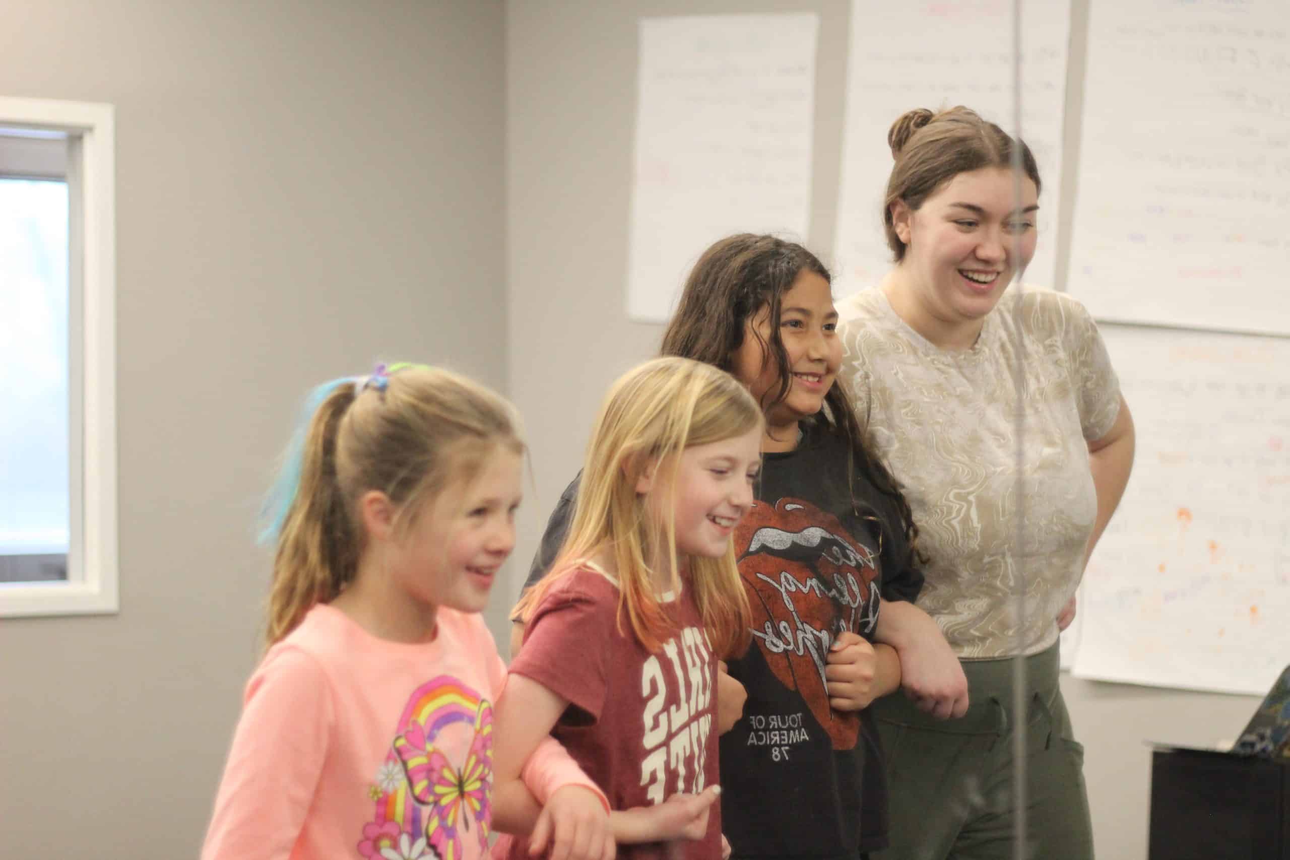 Instructor working with a child during a music lesson